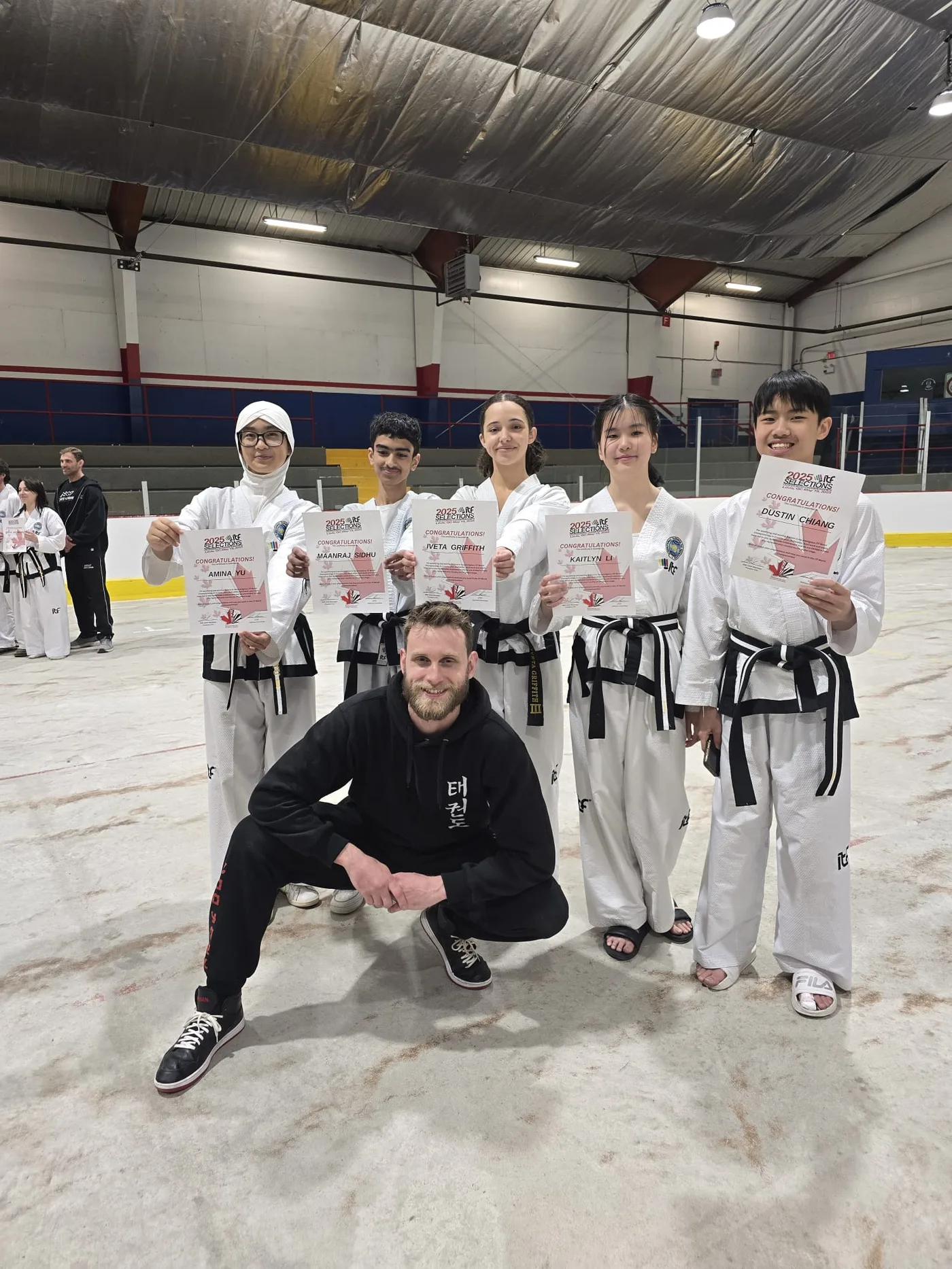 Coach Josiah with five athletes at ITF Taekwondo World Championships 2025